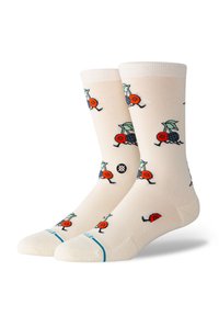Knee-length socks in light cream with colorful fruit and insect patterns, featuring red and blue accents and a turquoise band at the toe.
