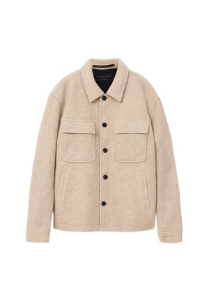 Beige Wolljacke mit Hemdkragen, zwei Brusttaschen und Seitentaschen. Mit schwarzen Knöpfen und einer weichen, strukturierten Oberfläche.