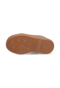 Semelle en caoutchouc beige avec un motif de semelle, comprenant des dessins circulaires et en zigzag. Fini lisse avec un bord légèrement surélevé.