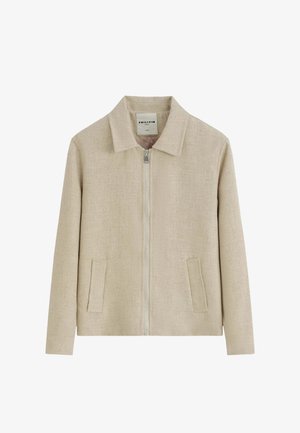 Veste en lin beige avec fermeture éclair intégrale à l'avant, col classique et deux poches frontales verticales, présentée sur fond blanc.