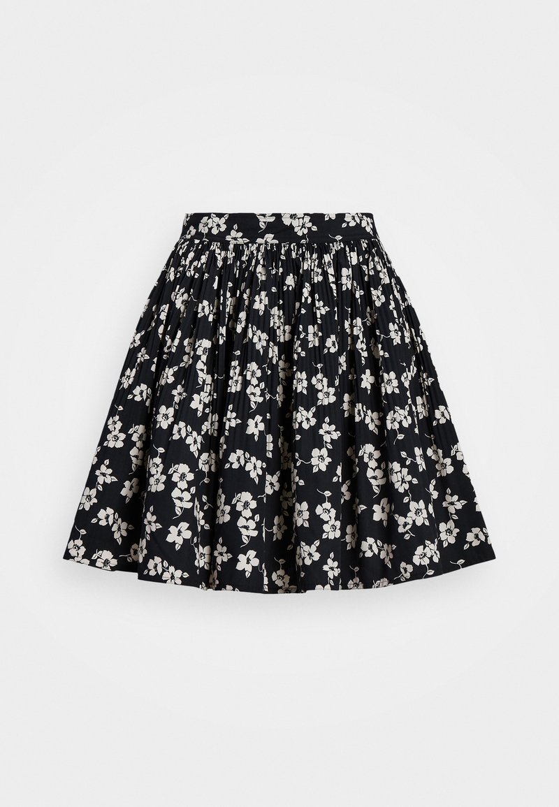 Jupe florale noire en coton, avec un design froncé et des motifs de fleurs blanches. Taille élastique pour le confort et l'ajustement.