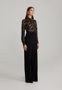 ANDIATA LUCIA - Pantaloni - black