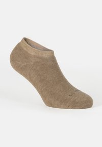 Calcetín bajo de color marrón claro, hecho de una tela suave, diseñado para un uso casual con un puño cosido y un refuerzo sutil en la punta.