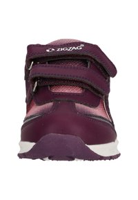 Purple athletic shoe with two Velcro straps, textured upper, and a white accents. Features a padded collar and a durable rubber sole.
