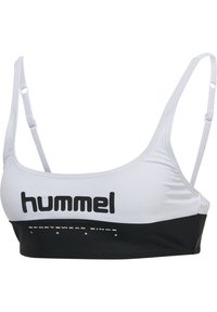 Vit sportbehå med justerbara band, med en svart rem i botten. Framsidan visar varumärket "hummel" i fet stil med svarta bokstäver.