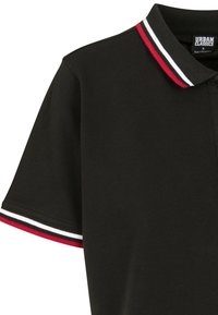Black polo shirt featuring a classic collar, short sleeves with red, white, and black striped accents at the cuffs and collar.