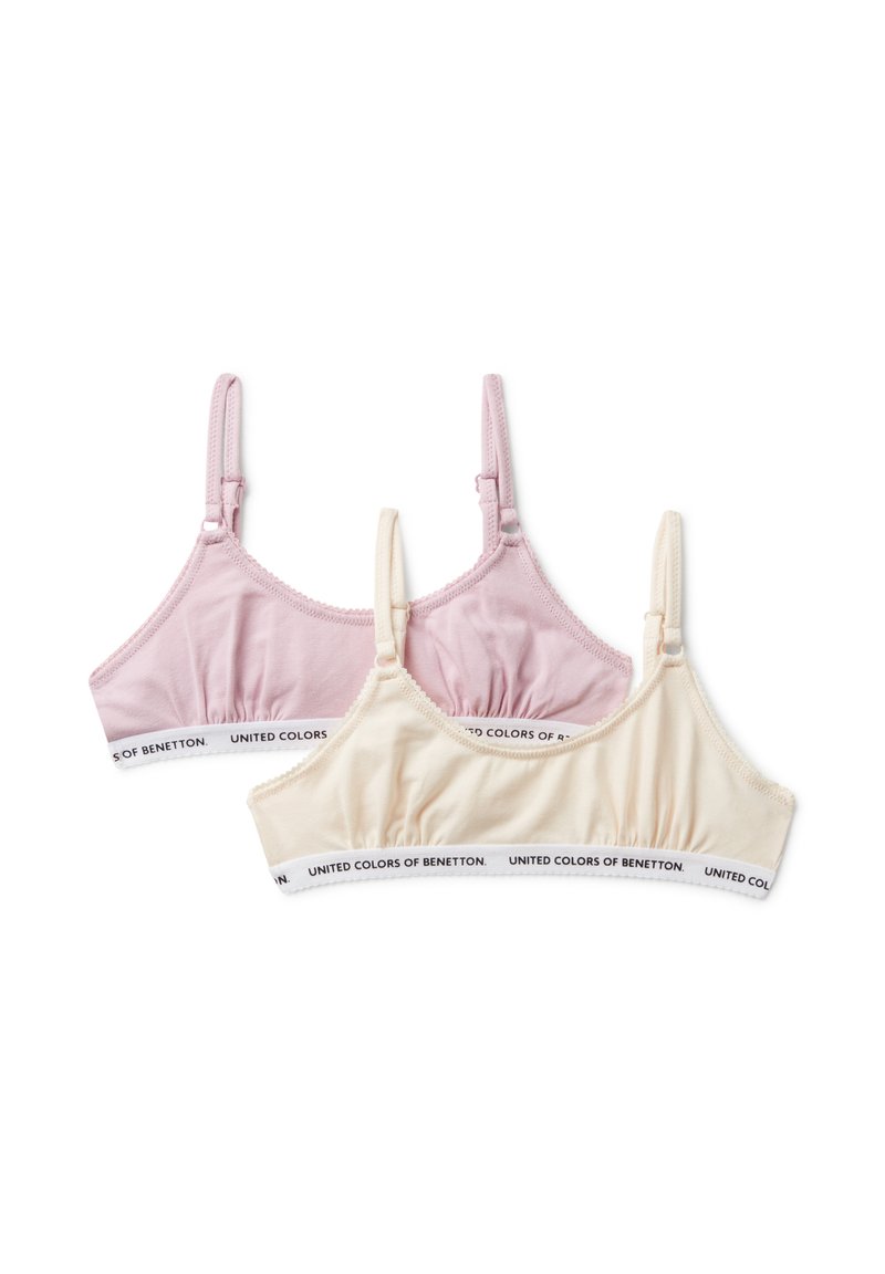 Dos suaves bralettes de algodón en rosa y beige con tirantes ajustables, que cuentan con bandas elásticas de la marca "United Colors of Benetton".