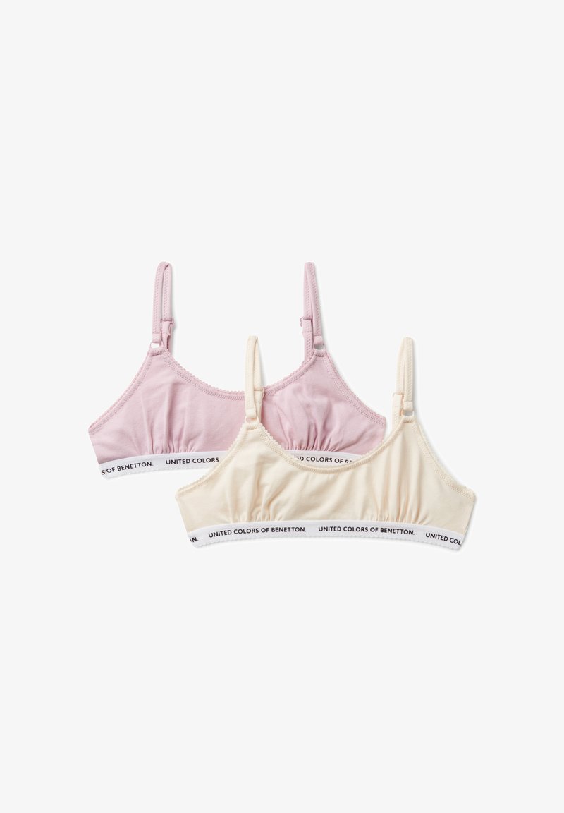 Dos suaves bralettes de algodón en rosa y beige con tirantes ajustables, que cuentan con bandas elásticas de la marca "United Colors of Benetton".