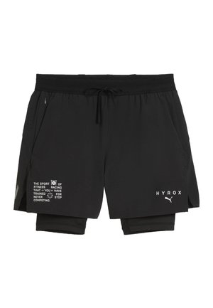 Schwarze athletische Shorts mit integriertem Kompressionslayer, Kordelzugbund, seitlicher Reißverschlusstasche und weißen HYROX- sowie Puma-Logos vorne.