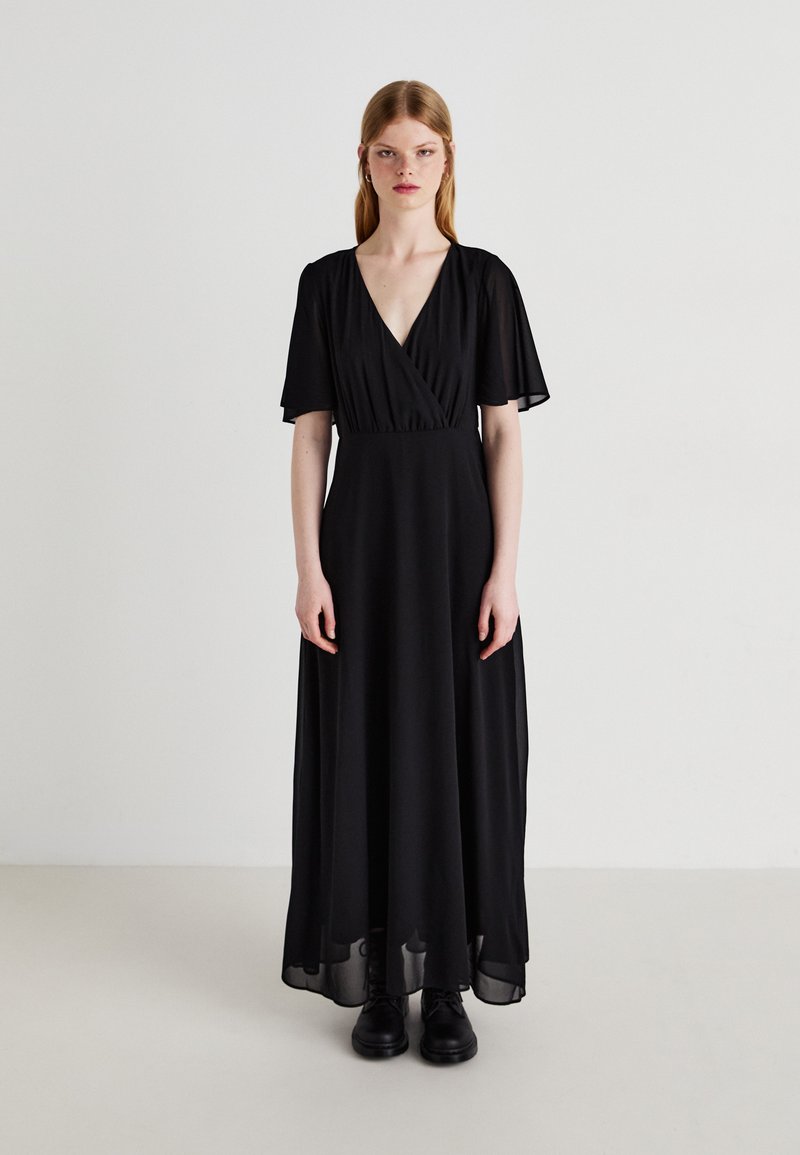 Black maxi dress with a deep V-neck, short flutter sleeves, and a flowing chiffon skirt, featuring a fitted bodice and subtle draping.