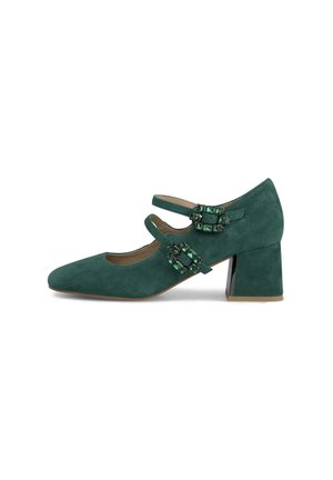 Teal suede Mary Jane shoes with two straps, jeweled accents, a pointed toe, and a chunky heel. Smooth texture and elegant design.
