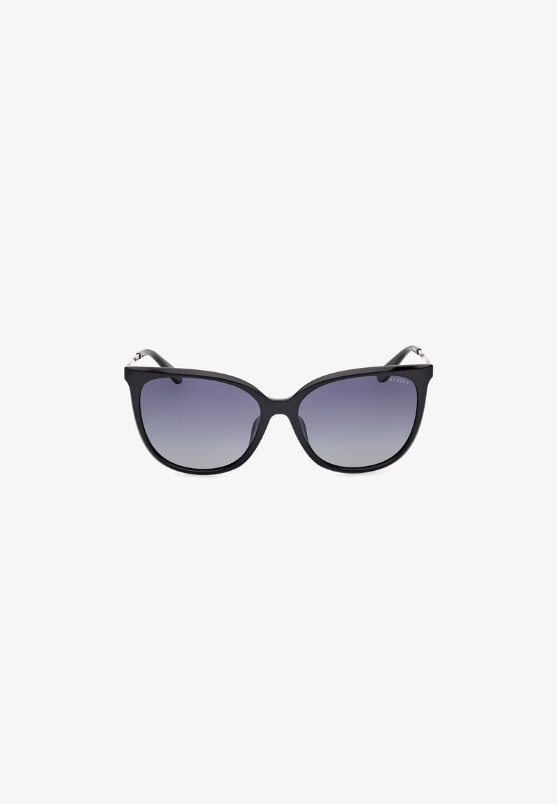 Black cat-eye sunglasses with gradient lenses, featuring a smooth plastic frame and subtle metallic accents on the temples.