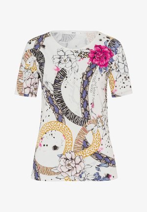 Biała koszula z krótkim rękawem z dużymi nadrukami kwiatowymi, splecionymi wzorami zwierzęcymi oraz napisem „Rób to, co sprawia, że czujesz się dobrze” na przodzie.