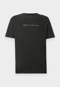 Μαύρο κοντομάνικο t-shirt με στρογγυλή λαιμόκοψη, με το "ARMANI EXCHANGE" τυπωμένο σε χρυσά γράμματα στο στήθος.