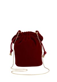 Red velvet drawstring bag with a gathered top, gold hardware, and a detachable chain strap. Smooth texture with a soft, luxurious appearance.