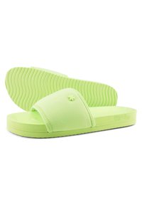 Light green slide sandals made of soft material with a smooth texture, featuring a wide strap and a ridged outsole for grip.