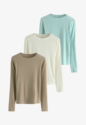 Three long-sleeve shirts in beige, white, and light blue. Ribbed texture, rounded necklines, and contrasting shoulder seams.
