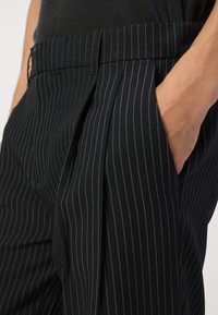 Jack & Jones JPSTBILL JJDAYTONA WIDE - Trousers - black