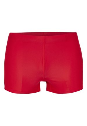 Červené športové kraťasy vyrobené z hladkej, elastickej látky. Majú priliehavý strih s elastickým pásom a dĺžku do polovice stehna.