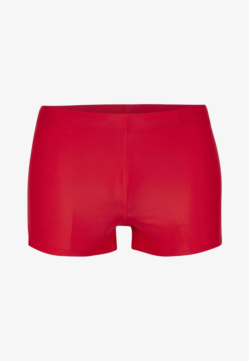 Red athletic shorts made of smooth, stretchy fabric. They have a fitted design with an elastic waistband and mid-thigh length.