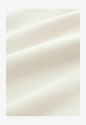 White cotton fabric with a smooth texture, featuring slight folds and a soft, even knit pattern. No visible patterns or accents.