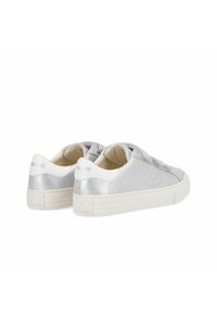 Silver sneakers with smooth metallic finish, white accents, and textured heel. Features a thick white sole and perforated design on the sides.
