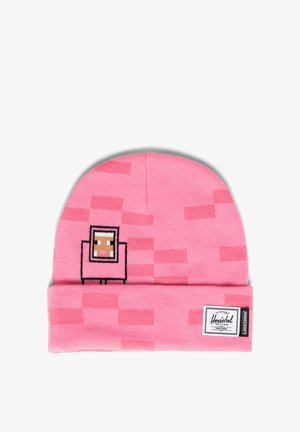 Różowa dzianinowa czapka z projektem postaci pixel art z Minecraft oraz metką marki Herschel na podwiniętym brzegu.