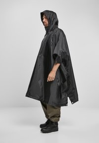 Brandit PONCHO - Vandeniui atspari striukė - black