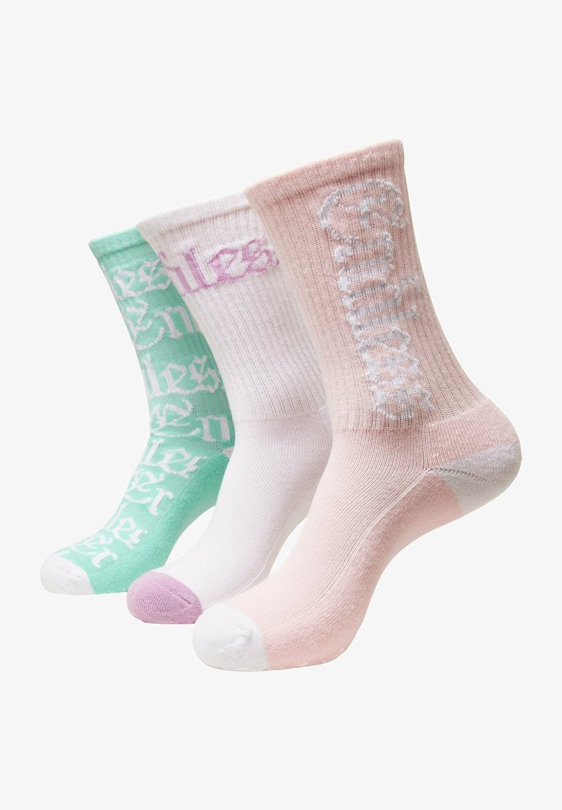 Tres pares de calcetas de tripulación en verde menta, blanco y rosa. Cada par cuenta con un diseño de texto, textura acanalada y colores de punta contrastantes.