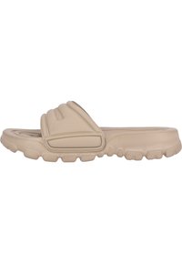 Beige slide sandal with a thick, textured sole and plush upper straps. Features a molded design and slight sheen, suitable for casual wear.