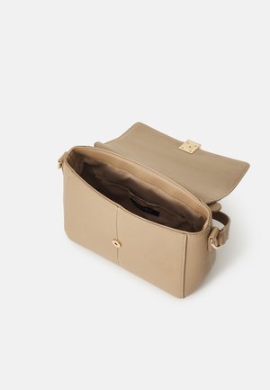 Beige rectangular crossbody bag with flap and gold clasp, open to show interior pocket and adjustable strap on a white background.