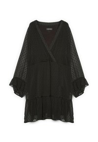 Blusa negra con escote en V, mangas largas abullonadas y un bajo con volantes en capas. Hecha de un tejido translúcido con una textura y un patrón de puntos.