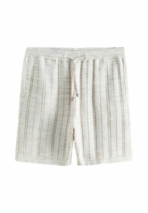 Lichtbeige gebreide shorts met verticale opengebreide strepen, een elastische tailleband en een koordsluiting op een witte achtergrond.