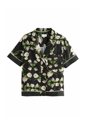 Korte mouw blouse van zwarte stof met een bloemenpatroon, met witte tulpen en groene bladeren, en een borstzakje met kantafwerking.