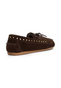 Brown suede moccasin with gold stud accents along the sides, a simple lace on top, and a flexible rubber sole.