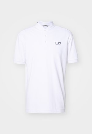 Polo shirt bianca con colletto alla francese, patta con tre bottoni e logo EA7 in blu navy. Realizzata in cotone con una texture liscia.
