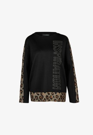 Zwarte top met lange mouwen met luipaardprintpanelen op de mouwen en zoom, met het woord "INSPIRATION" in verticale strass-steentjes op de voorkant.