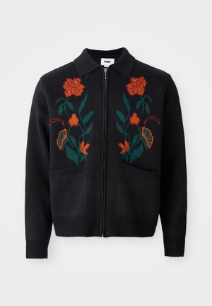Black cardigan with zip front, collar, floral embroidery in orange and green, ribbed cuffs and hem, and two front pockets.
