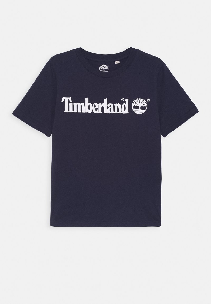 Camiseta de algodón azul marino con mangas cortas, con logo blanco de "Timberland" y gráfico de árbol en el frente, cuello redondo.
