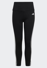 Leggings negros hechos de tela elástica con cintura alta, que presentan rayas laterales blancas y un logo de Adidas en la cadera izquierda.