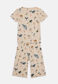 Cotton pajama set featuring a cream background with a sea-themed print, including whales, turtles, and jellyfish in various colors.
