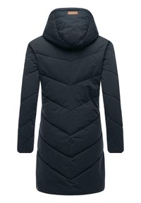 Dark blue hooded coat with a quilted chevron pattern, long sleeves, and a slightly curved hem. Features a small branded patch on the back.