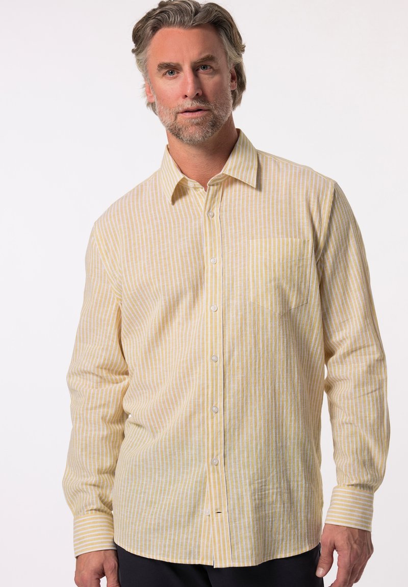 Lichtgele gestreepte shirt met lange mouwen, knoopsluiting en een borstzak. Stof lijkt zacht met een gestructureerde afwerking.