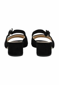 Zwarte suède haksandalen met een enkelbandje en decoratieve gesp, voorzien van een blokhak en een gladde binnenvoering.