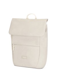 Beige backpack with a fold-over flap, front zip pocket, and a top handle. Made from smooth material with a minimalistic design.