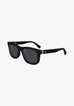 Óculos de sol pretos com uma armação grossa, lentes escuras e detalhes verde e branco nas hastes. Possui um detalhe de logotipo na lateral.
