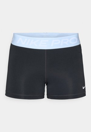 Juodos Nike Pro šortai su šviesiai mėlynu juosmeniu. Pasirinkta lygi, tampri medžiaga ir pritaikyta forma. Įeina baltas Nike logotipo akcentas.