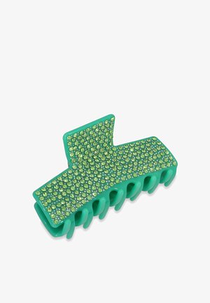 Grüner Acryllackenclip mit strukturierten Oberflächen, verziert mit hellgrünen Strasssteinen, mit geschwungenem Design und mehreren Haltezähnen.