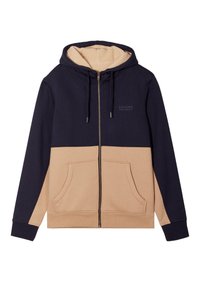 Felpa con zip e cappuccio, con parte superiore blu navy e parte inferiore beige, dotata di un rivestimento interno in pile e tasche frontali.