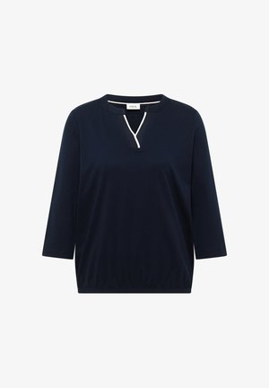 Tmavě modrý dámský top s tříčtvrtečními rukávy, elastickým lemem a výstřihem do V ozdobeným bílým lemováním.